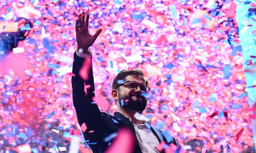 Chile’s president-elect, Gabriel Boric, waves to supporters