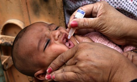 A baby is given polio vaccination in Pakistan