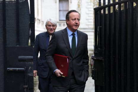 David Cameron, the foreign secretary, and Andrew Mitchell, the development minister, arriving in Downing Street for cabinet this morning.