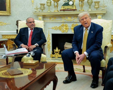 The crown prince of Bahrain listens Donald Trump speaks to reporters.