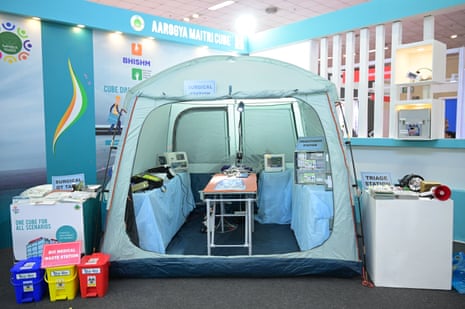 A tent with an operating table, monitor and anaesthetics inside