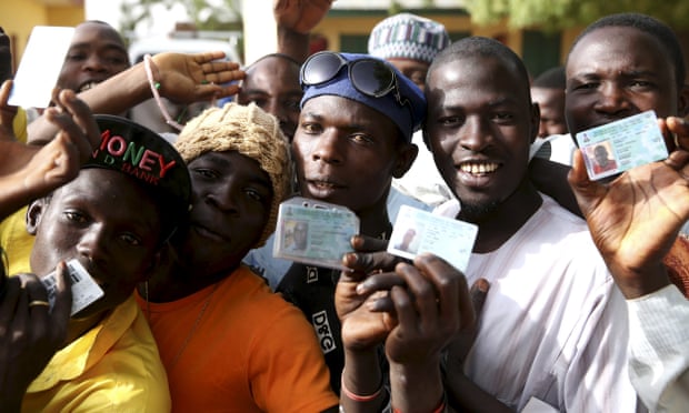 Menwait in line to register to vote during elections in Kano in March 2015.