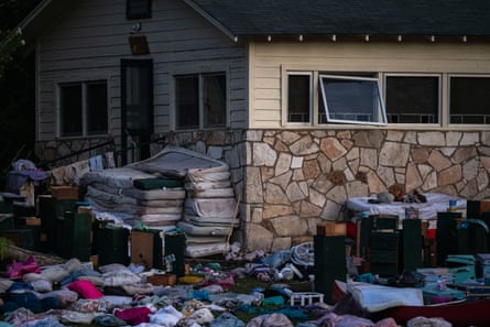 Campers’ belongings sit outside one of Camp Mystic’s cabins.