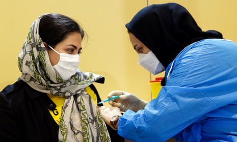 A woman receives a Covid-19 vaccination in Tehran, Iran, earlier this month.