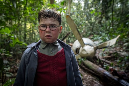 David McKenna, in dishevelled school uniform and wearing glasses, stares past the camera in dismay while playing Piggy in the forthcoming TV adaptation of Lord of the Flies