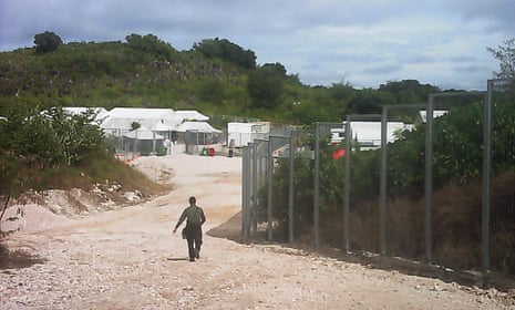 A guard near the entrance to the Nauru detention centre. The Nauru police seized phones and laptops from Save the Children staff on the island.
