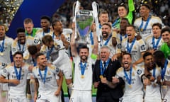 Nacho Fernández of Real Madrid lifts the Champions League trophy after the victory over Borussia Dortmund