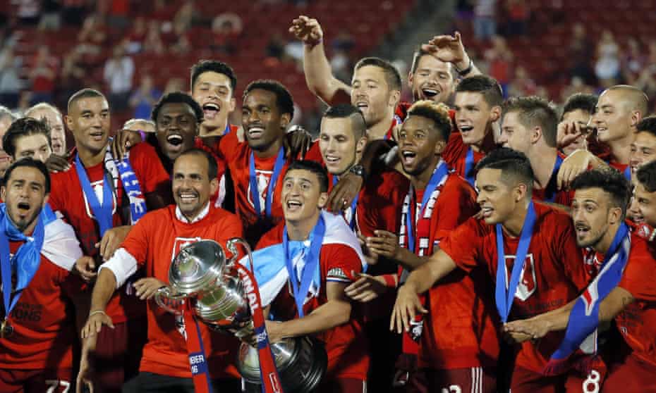 FC Dallas, who have a host of Latino players and coach from Colombia, show off their US Open Cup trophy after beating New England Revolution.