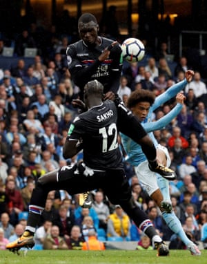 Manchester City’s Leroy Sane strikes a shot as Crystal Palace’s Christian Benteke and Mamadou Sakho attempt to block