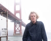 Grayson Perry standing near the Golden Gate Bridge in San Francisco