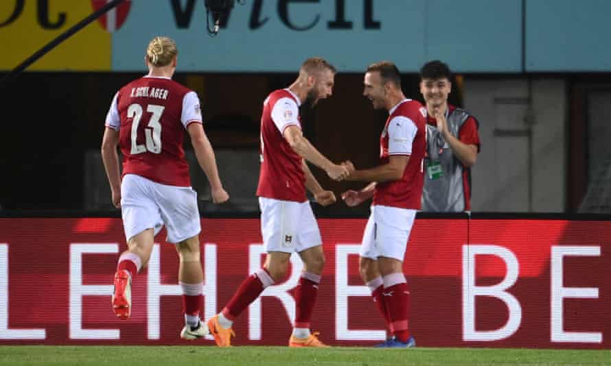 Austria’s forward Andreas Weimann (R) celebrates scoring the opening goal.