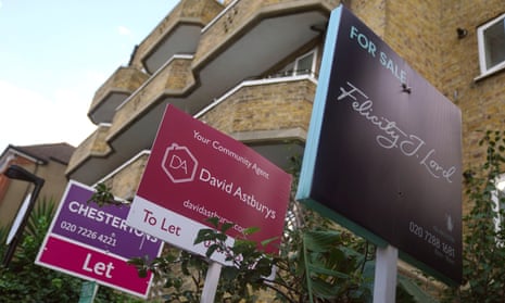 A photo of estate agents’ “to Let” and “for sale” signs in Islington, north London.