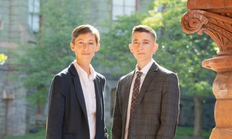 Dani S Bassett and Perry Zurn wearing suits in an academic setting