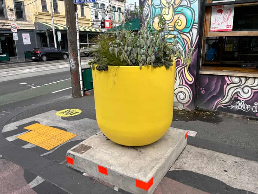 A giant yellow flower pot.