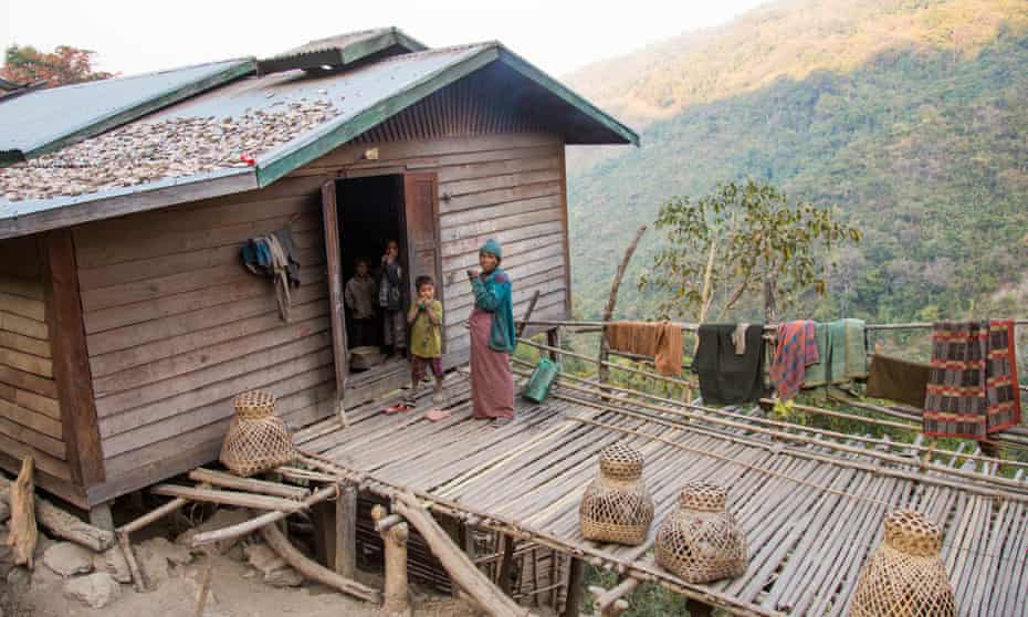 A Chin family living in their bamboo home in the hills of Mindat, Myanmar. 