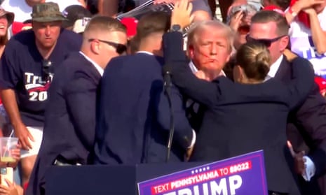 Trump rushed off stage bloodied after multiple gunshots heard at Pennsylvania rally