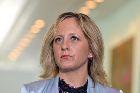 A woman with blond hair in a blue jacket