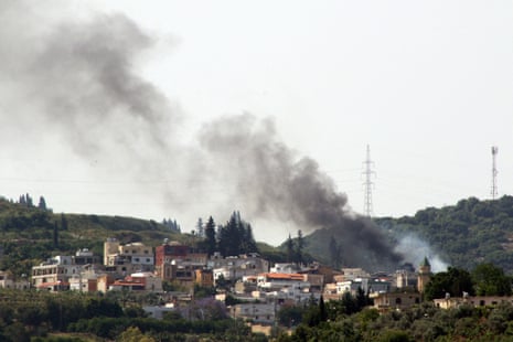 Smoke billows during Israeli bombardment over the Lebanese village of Najjariyeh on Friday, in southern Lebanon near the border with Israel.
