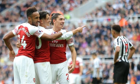 Pierre-Emerick Aubameyang, Mesut Özil and Héctor Bellerín celebrate after the Arsenal No 10 put the game beyond Newcastle’s reach.