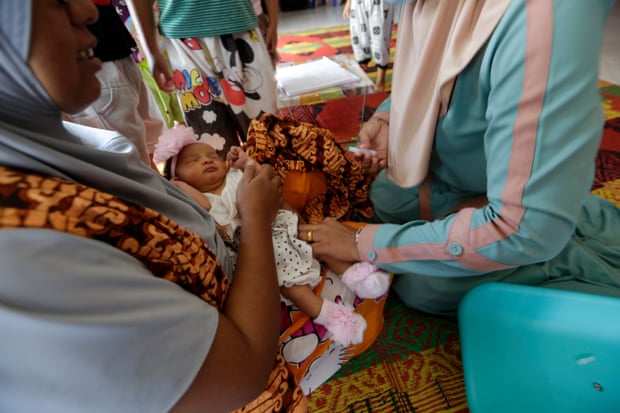 A child is vaccinated against polio and diphtheria in Banda Aceh, Indonesia.