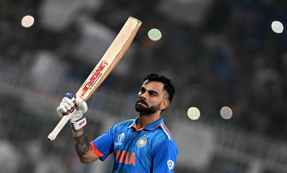 Virat Kohli celebrates after scoring a century for India against South Africa in 2023.