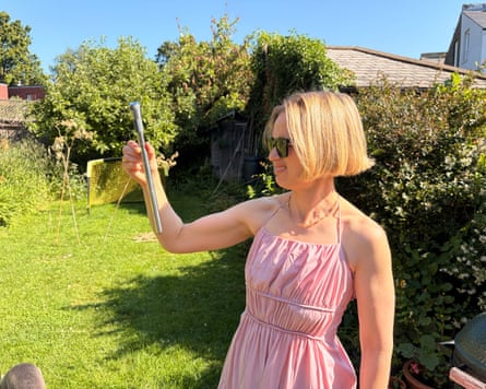The writer in a garden with an Uberstar wine chill stick.