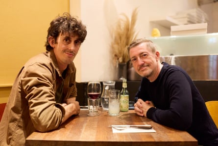 Edward and Martin chatting at a restaurant table