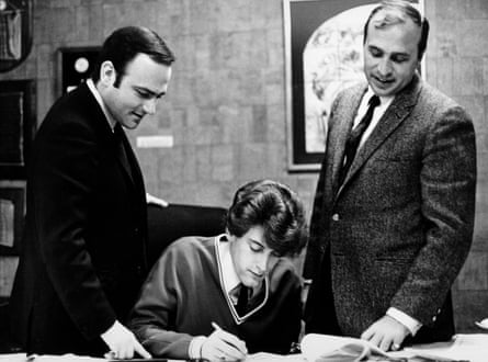 James signing a contract with Morris Levy (right), circa 1970.