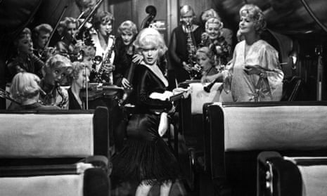 Marilyn Monroe as Sugar Kane, singer and ukulele player for the female band in Some Like It Hot. 