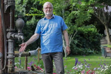 Bruno Wollenschneider, eco activist, lets water from an outdoor public tap run over his hand.