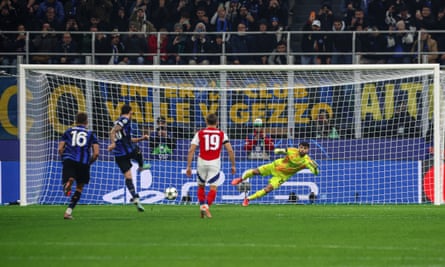 Hakan Calhanoglu scores a penalty for Inter against Arsenal.