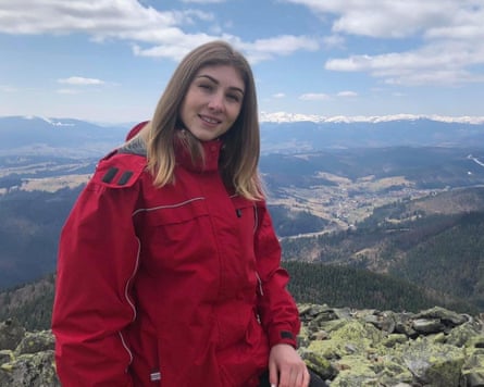 A picture of Tetiana smiling during a hike in the mountains