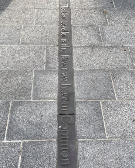 The inscription in the pavement saying: “The best leveller is the river we have in common”, on the University Boat Race starting line at Putney Embankment.