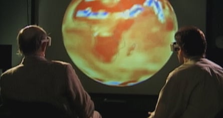 two people wearing goggles looking at a screen