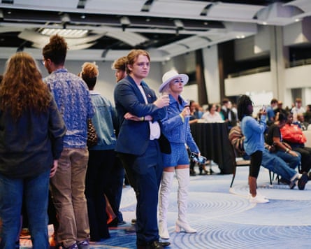 people stand in large room