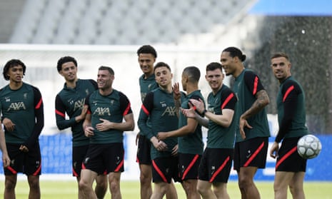 Liverpool players share a laugh during a training session.