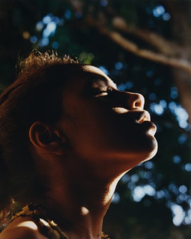 Respiro, 2019. A young woman raises her head with closed eyes, looking meditative