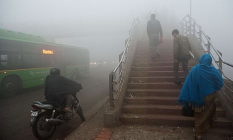Commuters struggle through the smog in Delhi. India’s air pollution costs an estimated one million lives a year.