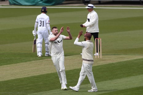 Gus Atkinson celebrates taking the wicket of Hampshire’s Liam Dawson on a green-top.