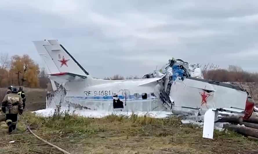 Rescue workers inspect the L-410 light aircraft after it crashed in Tatarstan.