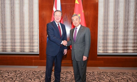 Chinese foreign minister, Wang Yi (right), meets Cameron at the Munich security conference, 16 February.