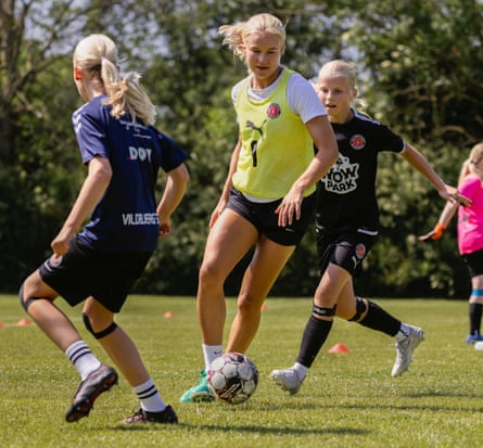 Pernille Harder runs with the ball in training