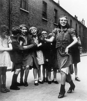 Girl dances as her friends laugh