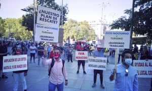 Owners of restaurants and cafes affected by coronavirus gather to stage a protest in Madrid