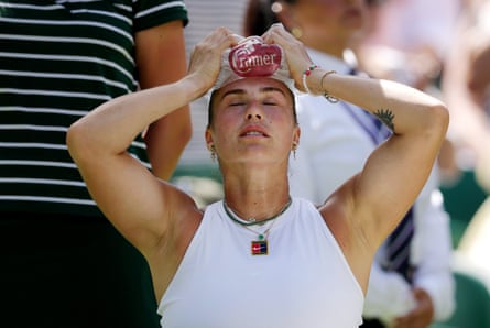 Aryna Sabalenka holds ice on her head