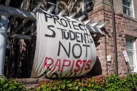 a sign reads âÂÂprotect students not rapistsâÂÂ