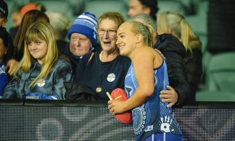 Ella Mauer of the North Melbourne Kangaroos with fans after an AFLW match against the Geelong Cats at University of Tasmania Stadium in Launceston in September
