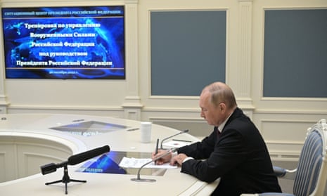 Russian President Vladimir Putin oversees the training of the strategic deterrence forces, troops responsible for responding to threats of nuclear war, via a video link in Moscow on October 26, 2022.
