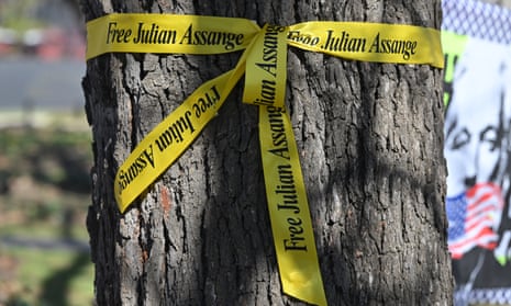 Free Assange signs tied around tree trunks outside the National Press Club of Australia