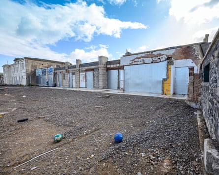 Abandoned, decaying exterior of building facing onto what was once the lido
